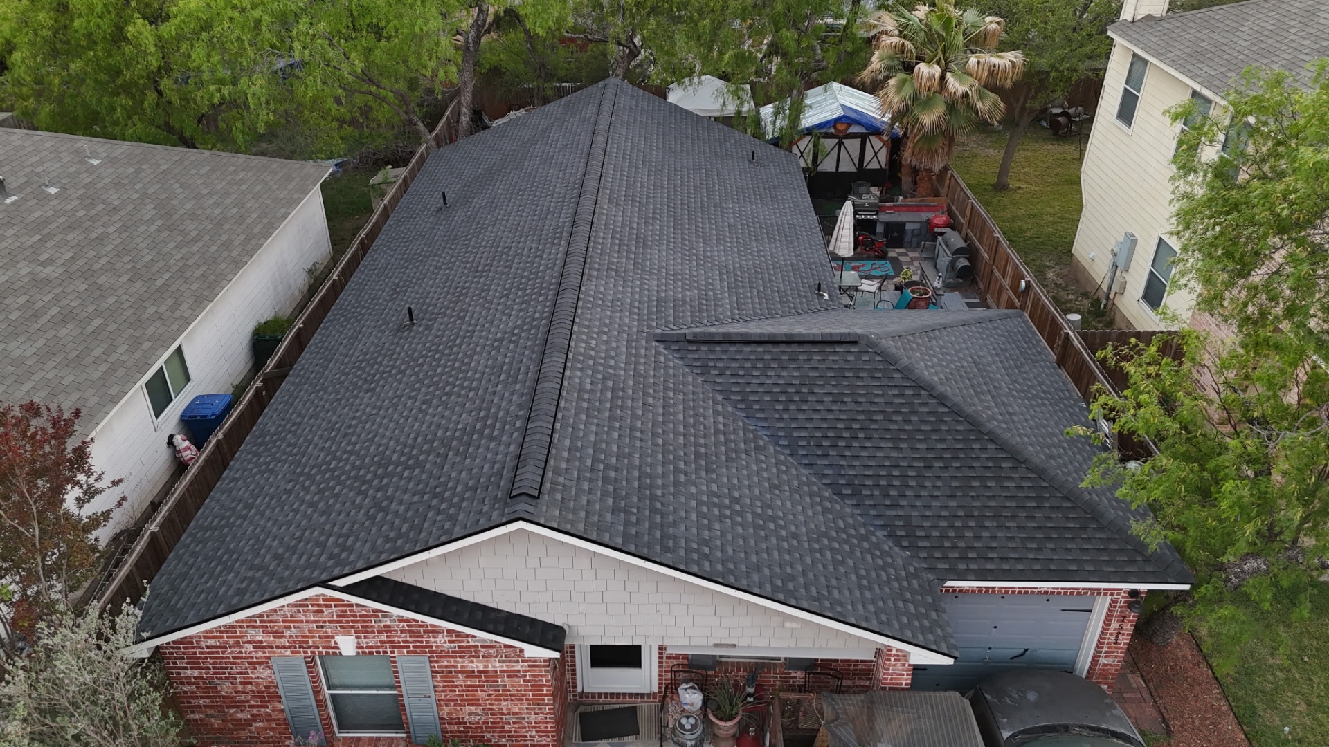 Completed front aerial of finished West Side San Antonio charcoal roof replacement