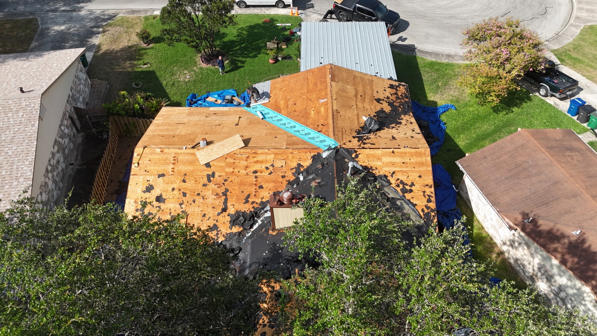 Decking inspection and selective plywood replacement before underlayment