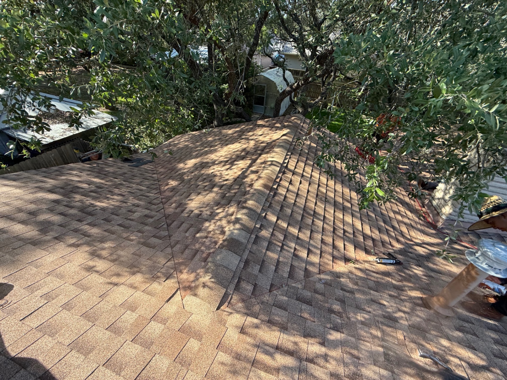 Hollywood Park roof replacement in progress with completed GAF Timberline HDZ shingles on one side and dry-in on the other