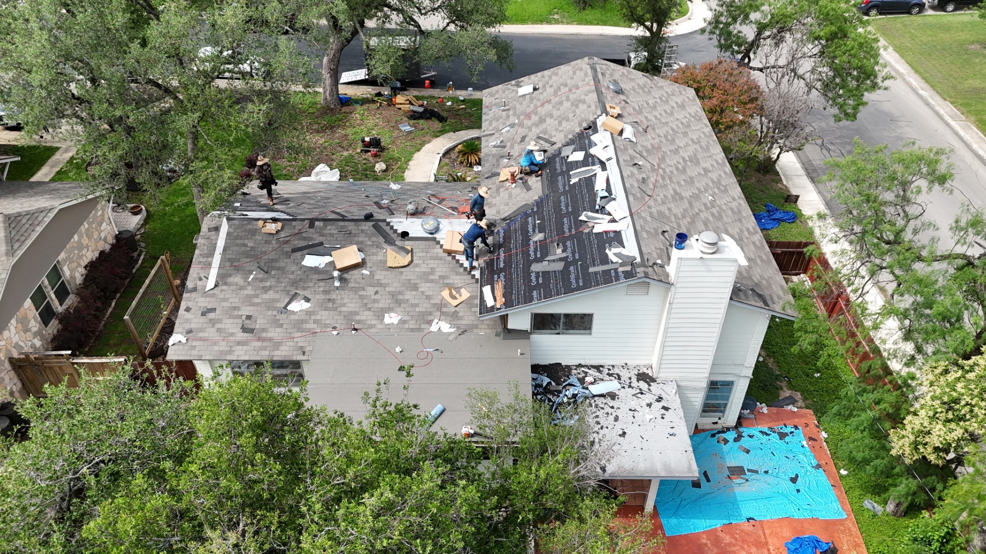 Aerial view of new architectural shingles being installed over CertainTeed underlayment