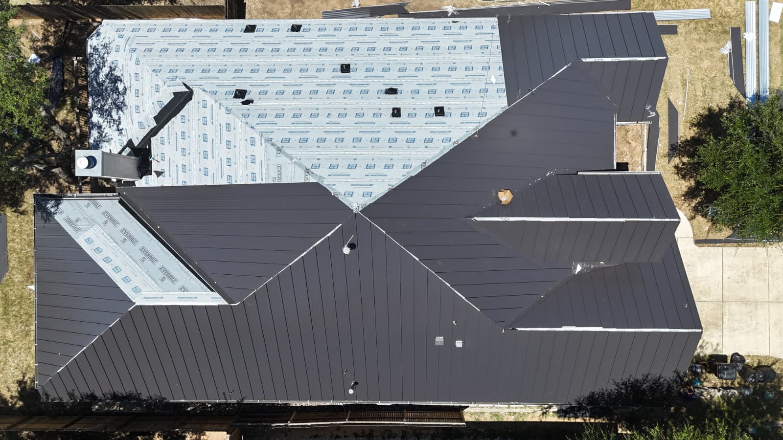 Aerial drone view of San Antonio standing seam metal roof partially installed