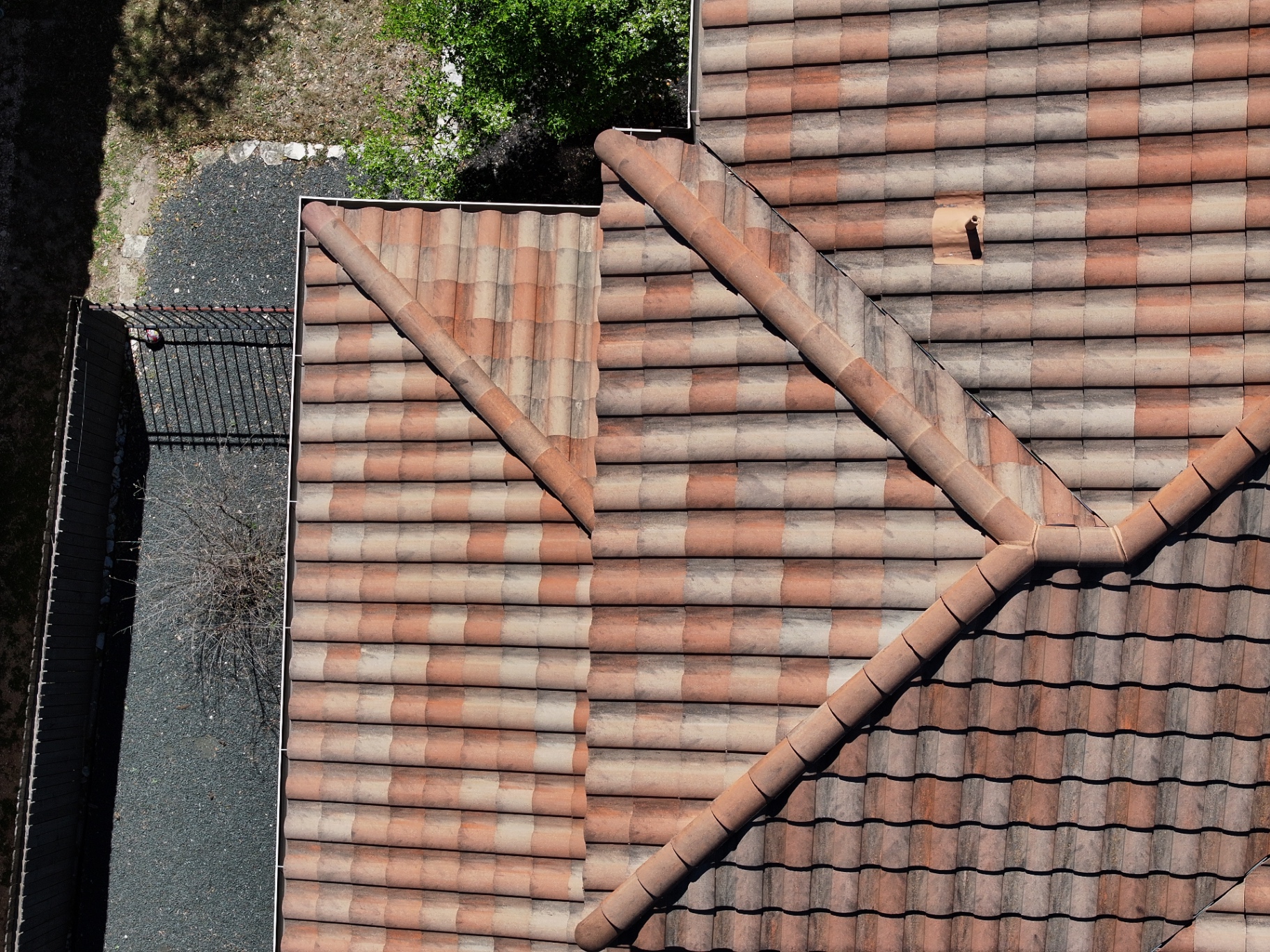 Top-down drone view of repaired tile section blended into the surrounding roof in Boerne