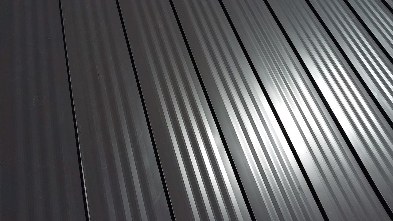 Close-up texture of finished charcoal standing seam metal panels