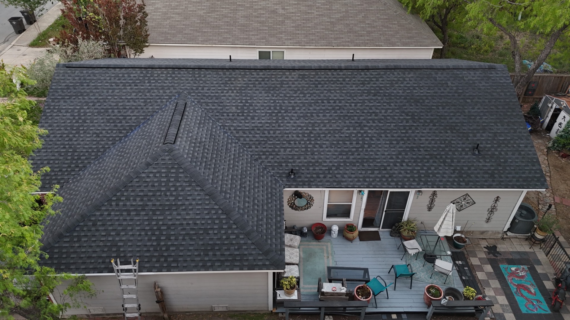 Completed rear aerial of finished West Side San Antonio roof over patio and addition