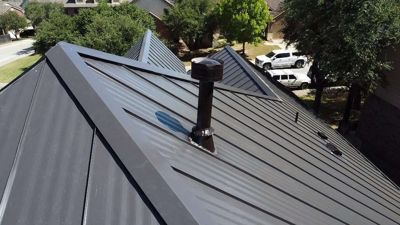 Detail of pipe boot flashing on completed standing seam metal roof