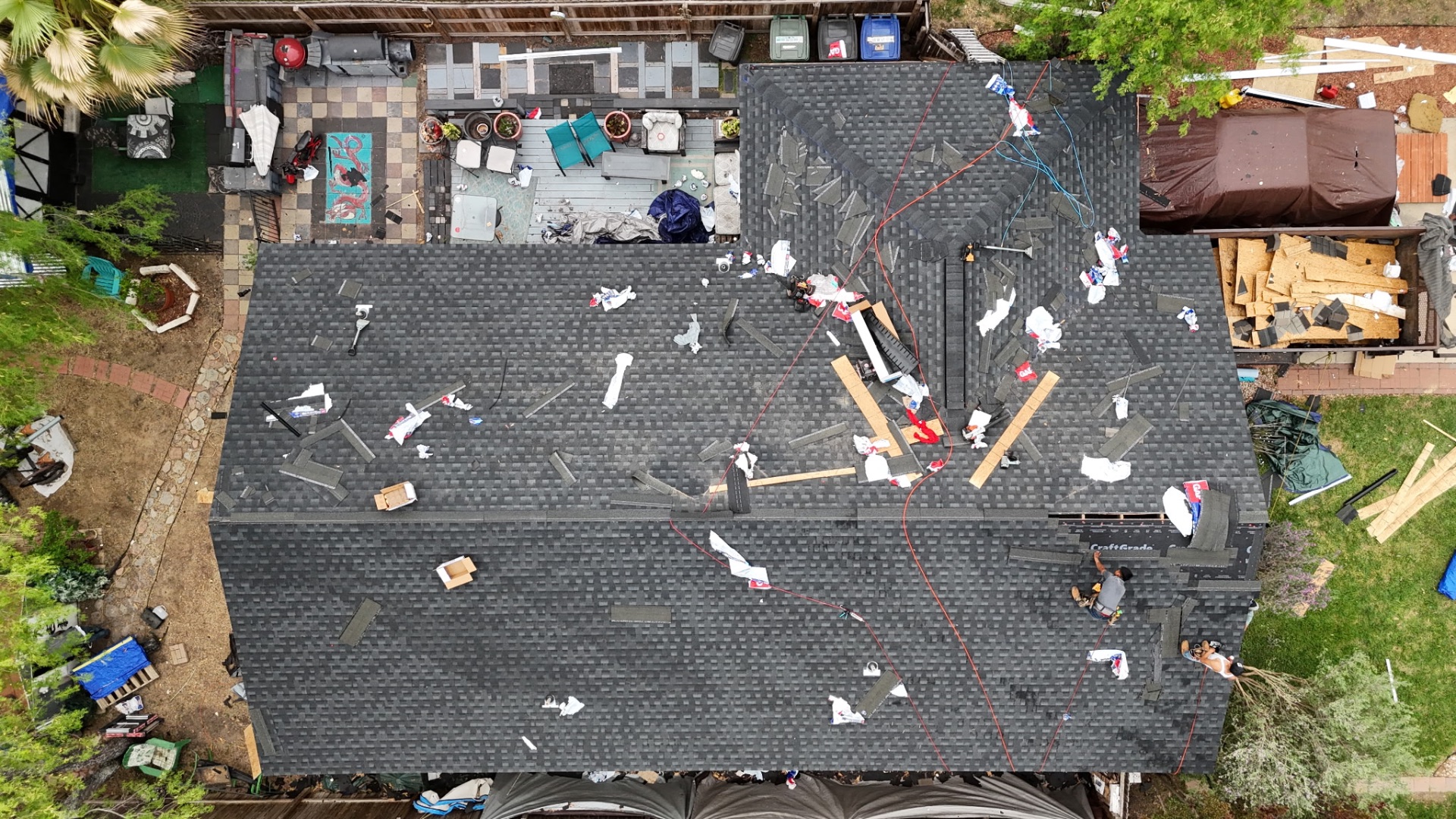Top-down drone view of West Side San Antonio roof replacement in progress