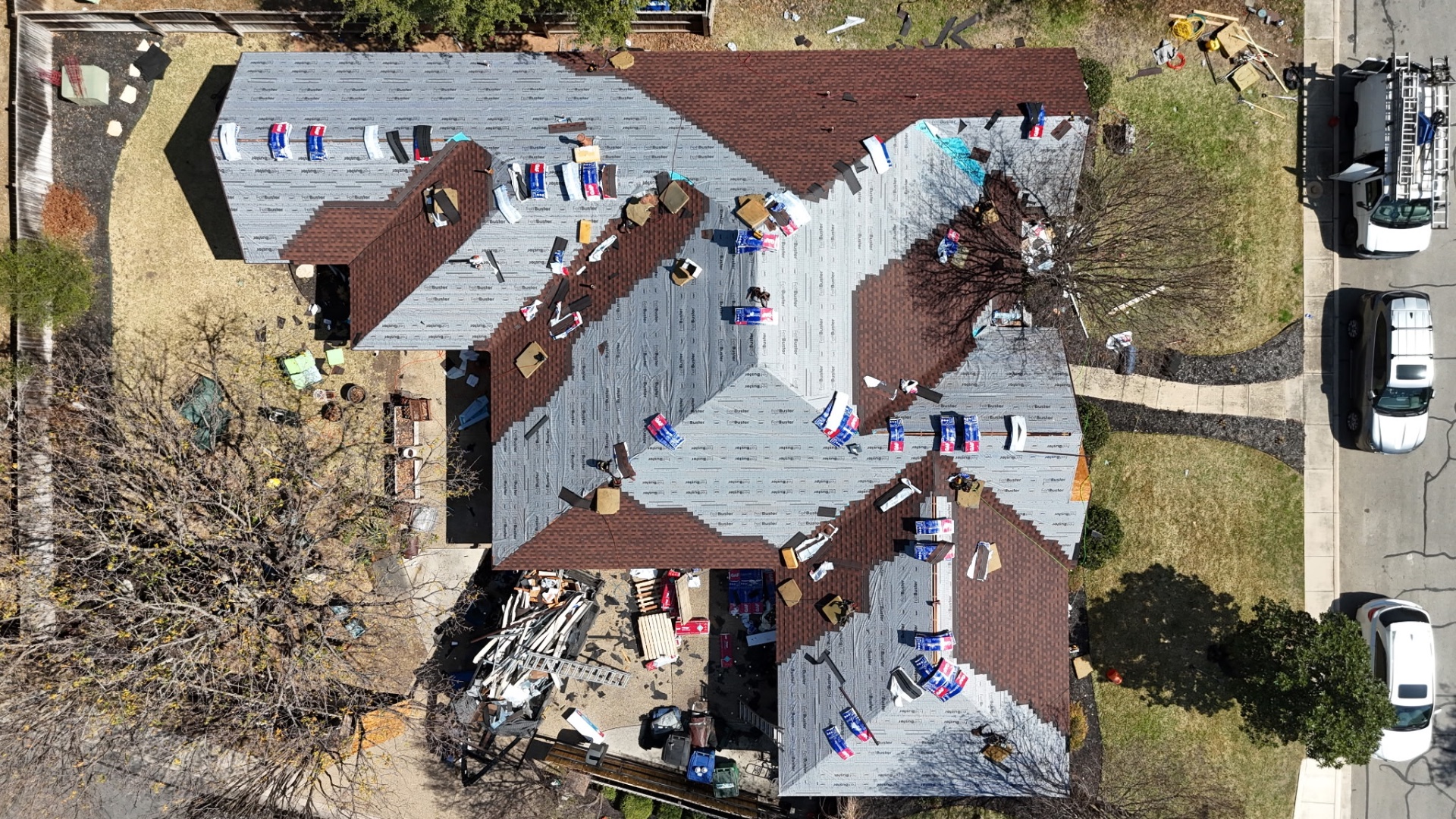 Overhead drone photo of Helotes roof replacement during dry-in with synthetic underlayment