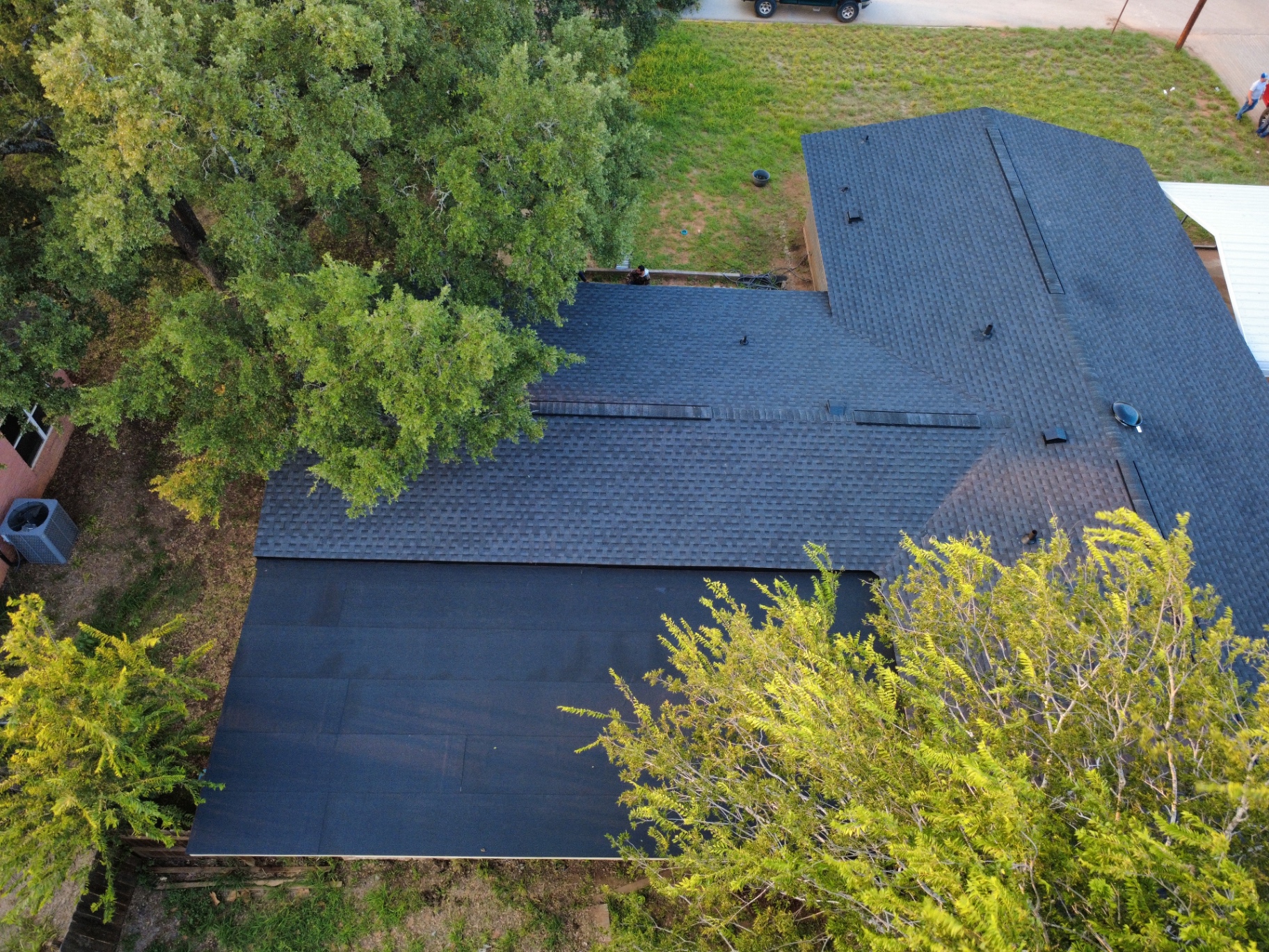 Rear aerial showing completed GAF Timberline HDZ Class 3 roof replacement in Pearsall