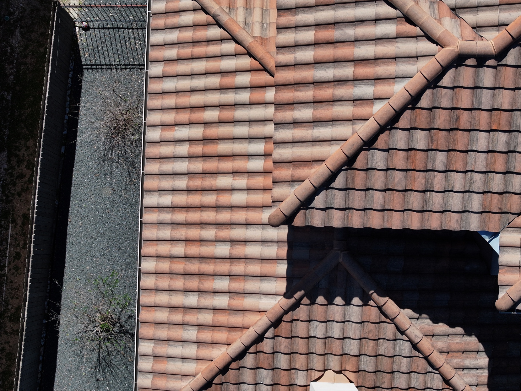 Overhead drone photo of tile repair area matching adjacent roof planes in Boerne