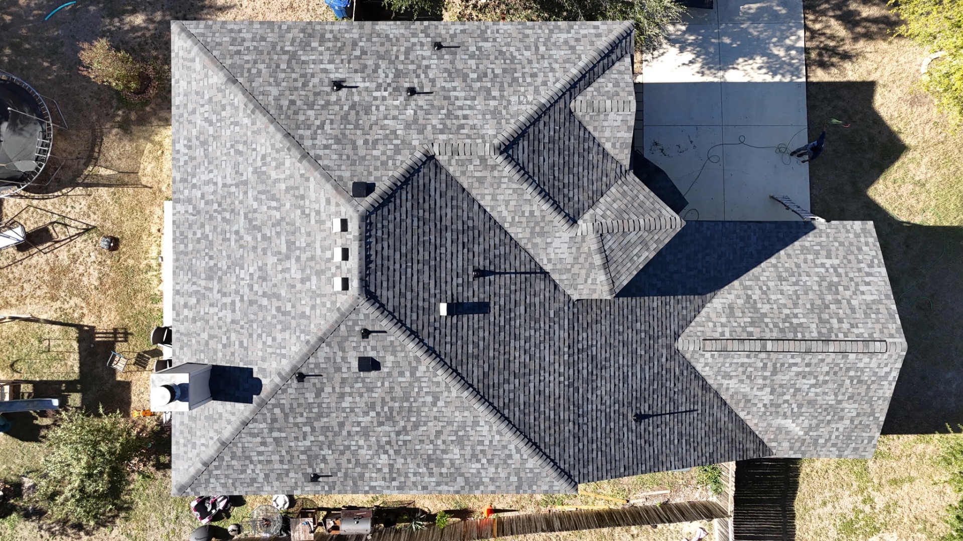 Top-down drone photo of finished Stone Oak architectural shingle roof
