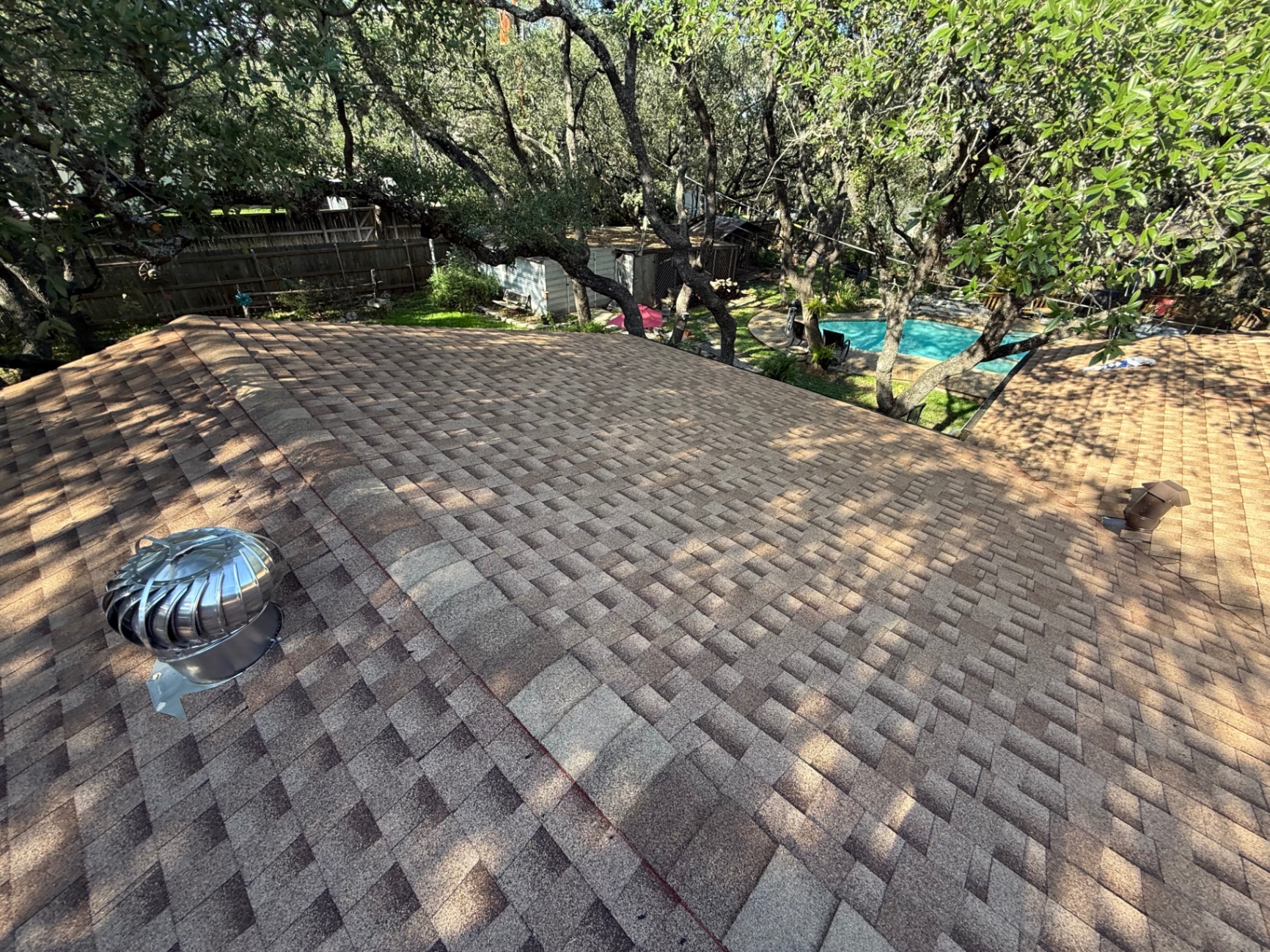 Finished GAF Timberline HDZ shingle roof in Hollywood Park with ridge detail and completed slopes