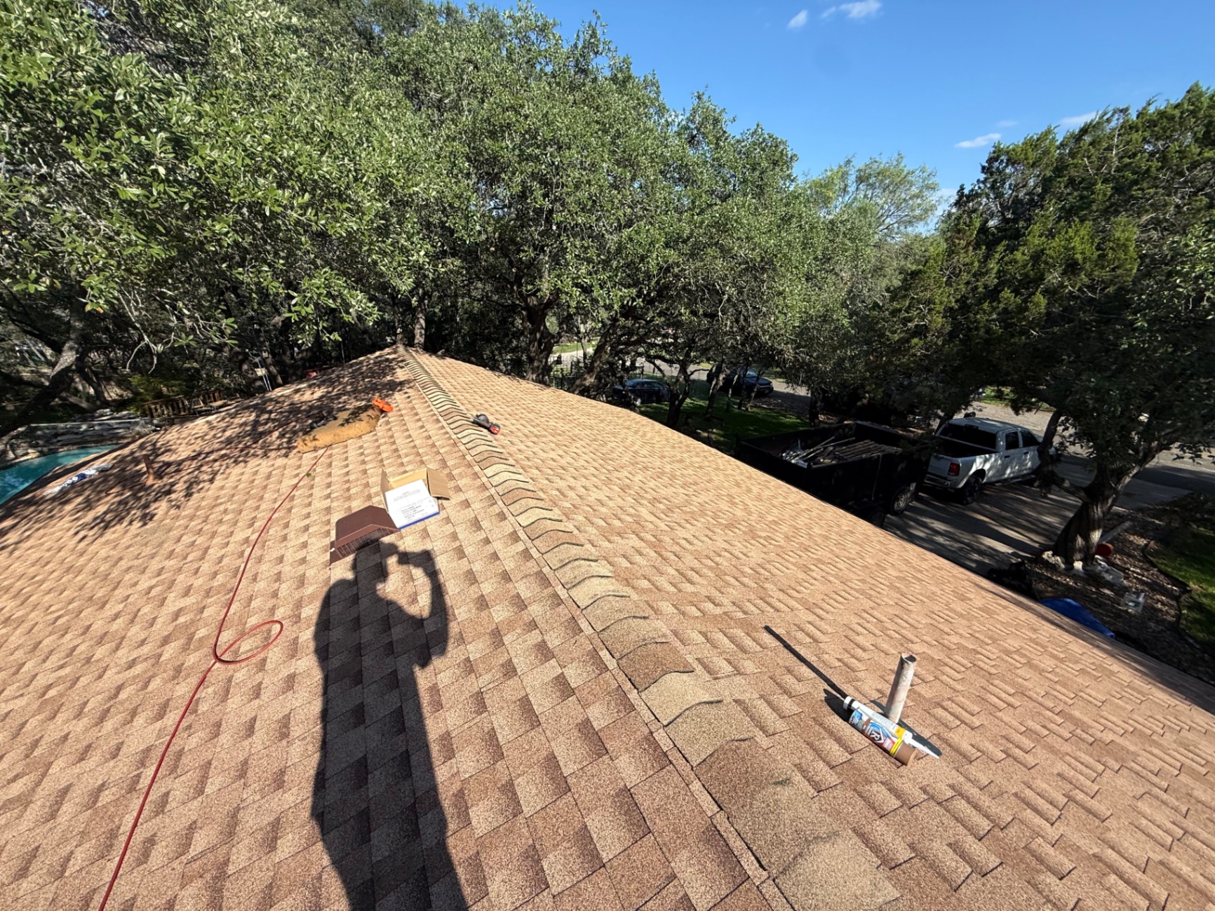 Completed Hollywood Park GAF Timberline HDZ roof showing clean ridge line and finished penetration details