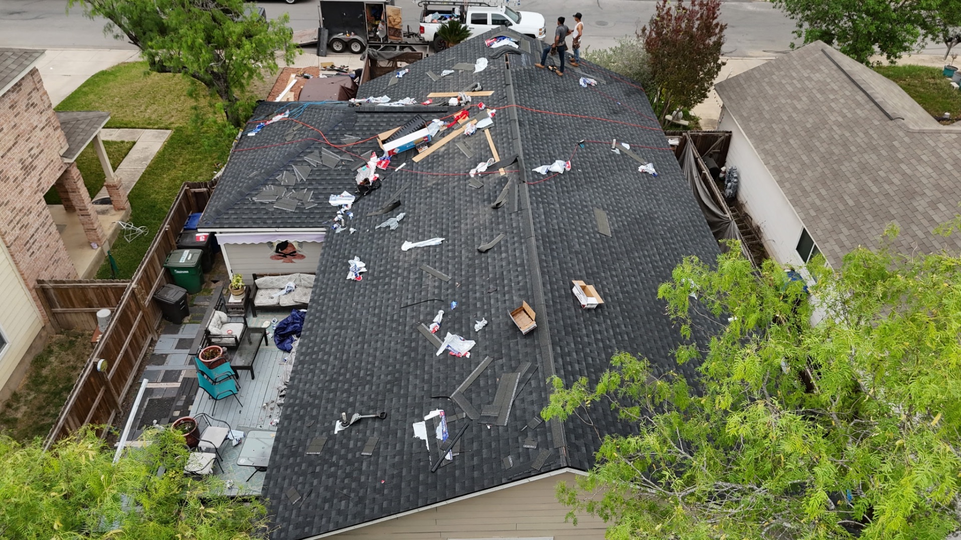 Angled drone view of West Side San Antonio roof replacement during installation