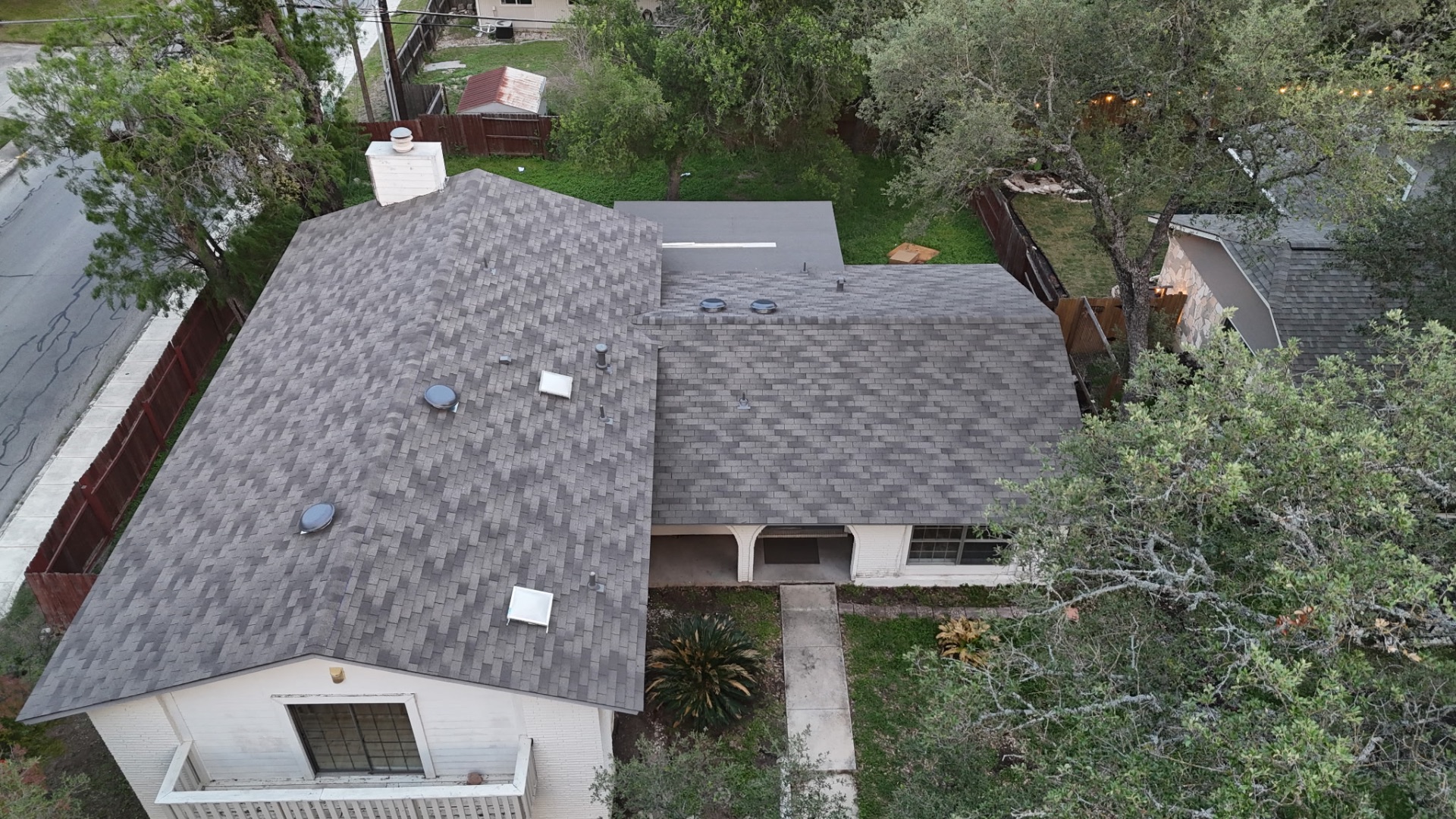 Front aerial of completed San Antonio asphalt shingle roof replacement