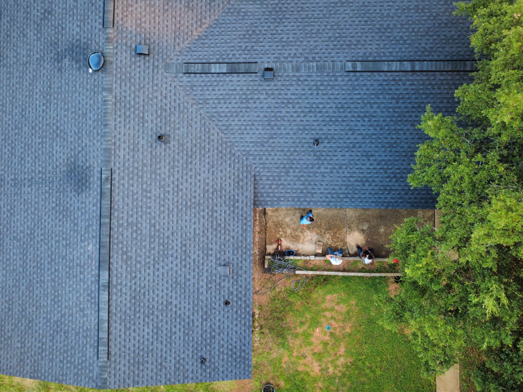 Overhead detail of finished GAF Timberline HDZ Class 3 shingles and ridge lines in Pearsall