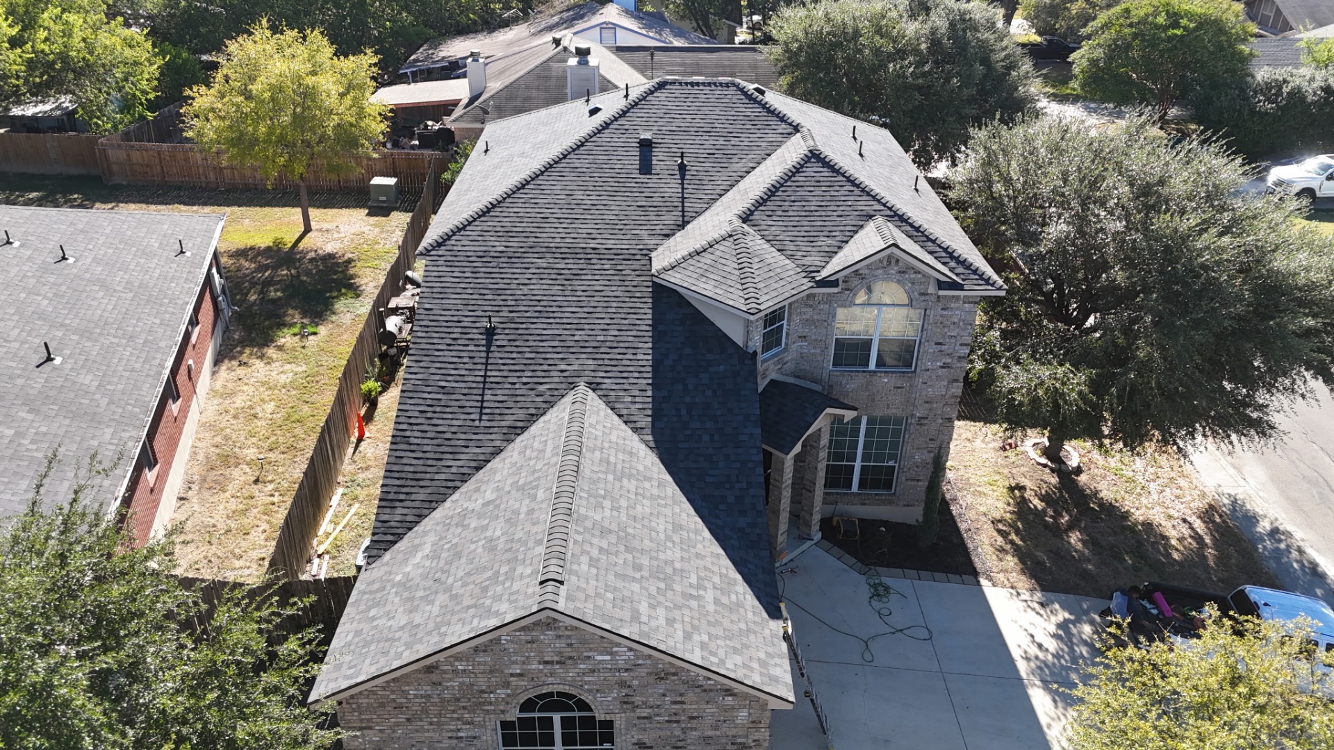 Front aerial view of completed Stone Oak roof replacement in San Antonio