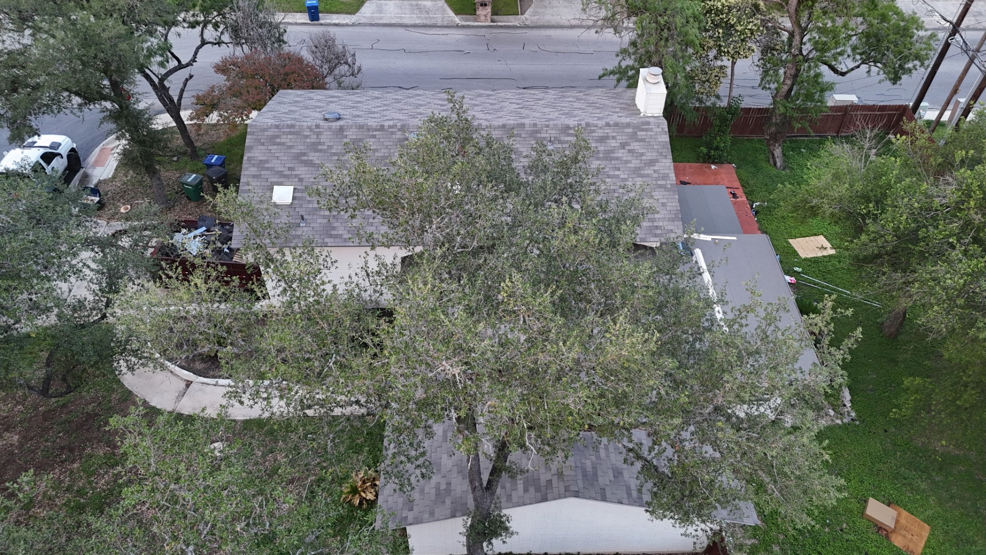 Street-side aerial view of finished roof after insurance appraisal-funded replacement